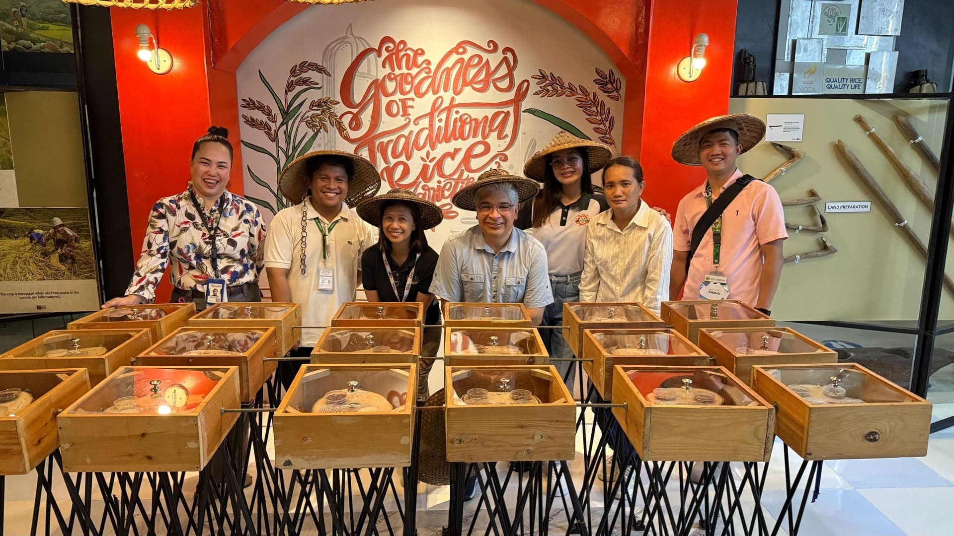 Central Luzon State University faculty and staff with volunteer Dr. Samuel Sandoval Solis at a traditional rice varieties exhibit, Philippines